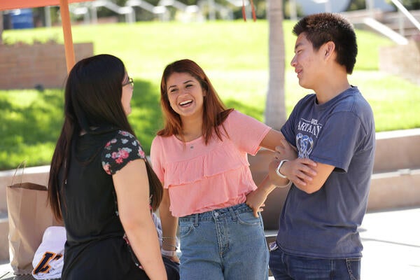 students talking on campus